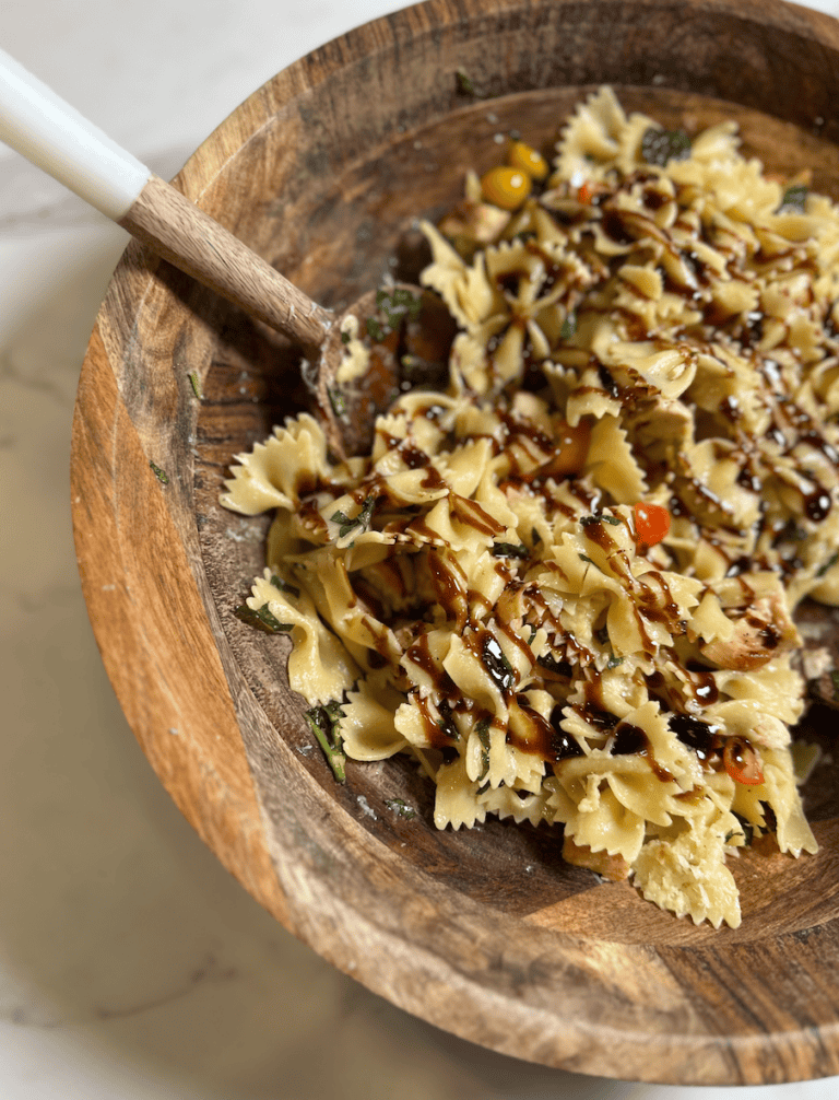 Chicken Bruschetta Pasta topped with fresh basil and balsamic glaze, an easy garden-to-table summer dinner recipe made with tomatoes, chicken, and pasta.