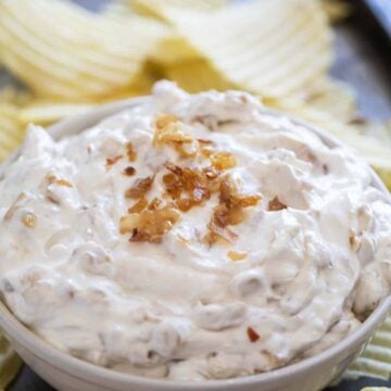3 Ingredient Chipotle Onion Dip made with sour cream, onion soup mix, and smoky chipotle peppers in adobo, served with chips.