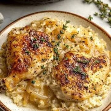 One Pan French Onion Chicken and Rice made with tender chicken breast, jasmine rice, onions, beef broth, and beef consommé baked together in one casserole dish.