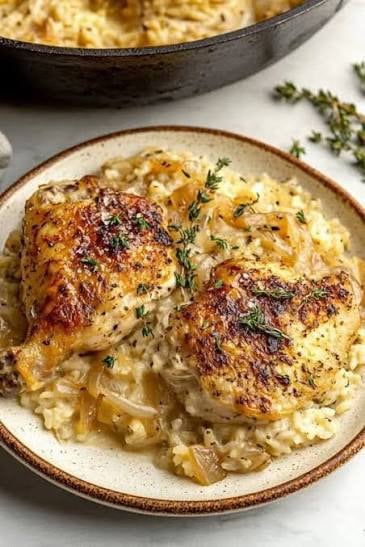 One Pan French Onion Chicken and Rice made with tender chicken breast, jasmine rice, onions, beef broth, and beef consommé baked together in one casserole dish.