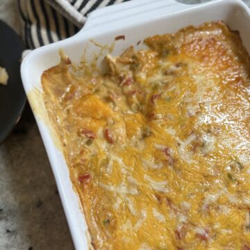 King Ranch Chicken Casserole made with rotisserie chicken, corn tortillas, creamy sauce, and melted cheese, baked until golden and bubbly.