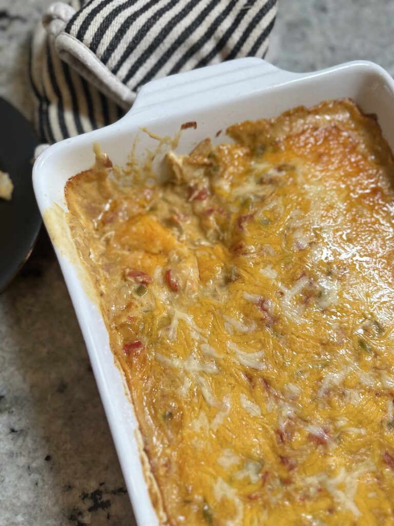 King Ranch Chicken Casserole made with rotisserie chicken, corn tortillas, creamy sauce, and melted cheese, baked until golden and bubbly.