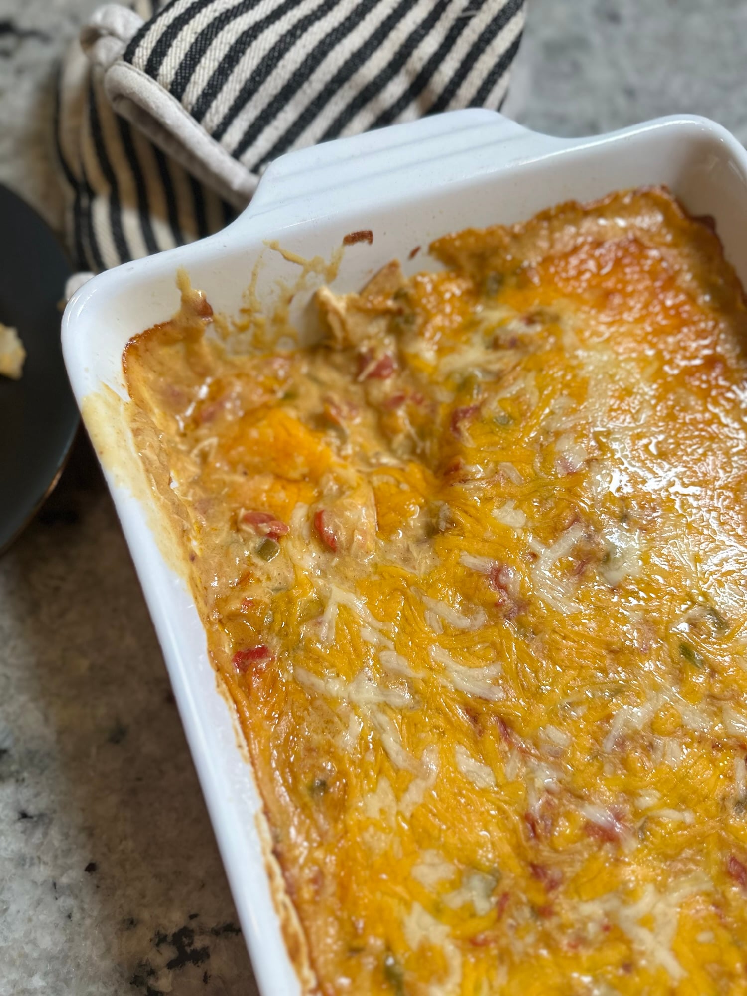 King Ranch Chicken Casserole made with rotisserie chicken, corn tortillas, creamy sauce, and melted cheese, baked until golden and bubbly.