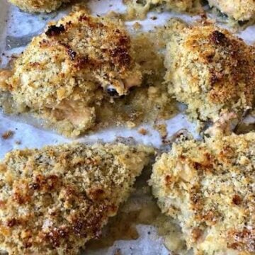 Ina Garten crispy mustard roasted chicken served with creamy zucchini gratin