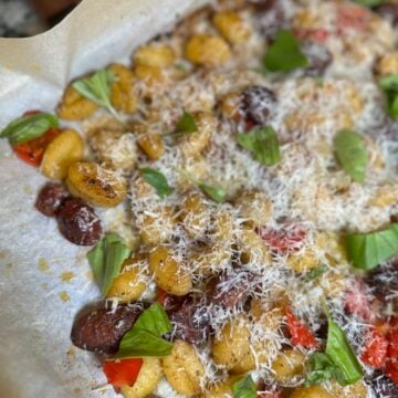 Sheet pan smoked Italian sausage with roasted peppers, onions and crispy potato gnocchi.