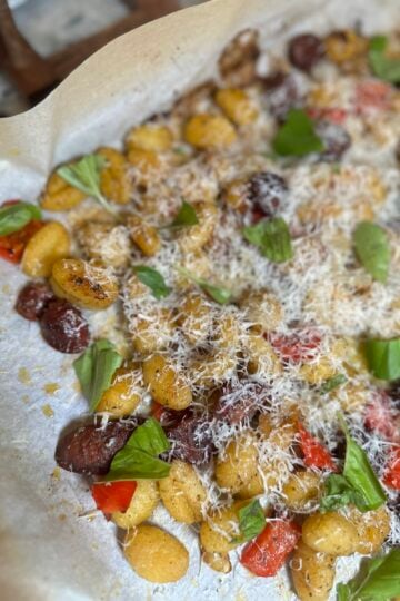 Sheet pan smoked Italian sausage with roasted peppers, onions and crispy potato gnocchi.