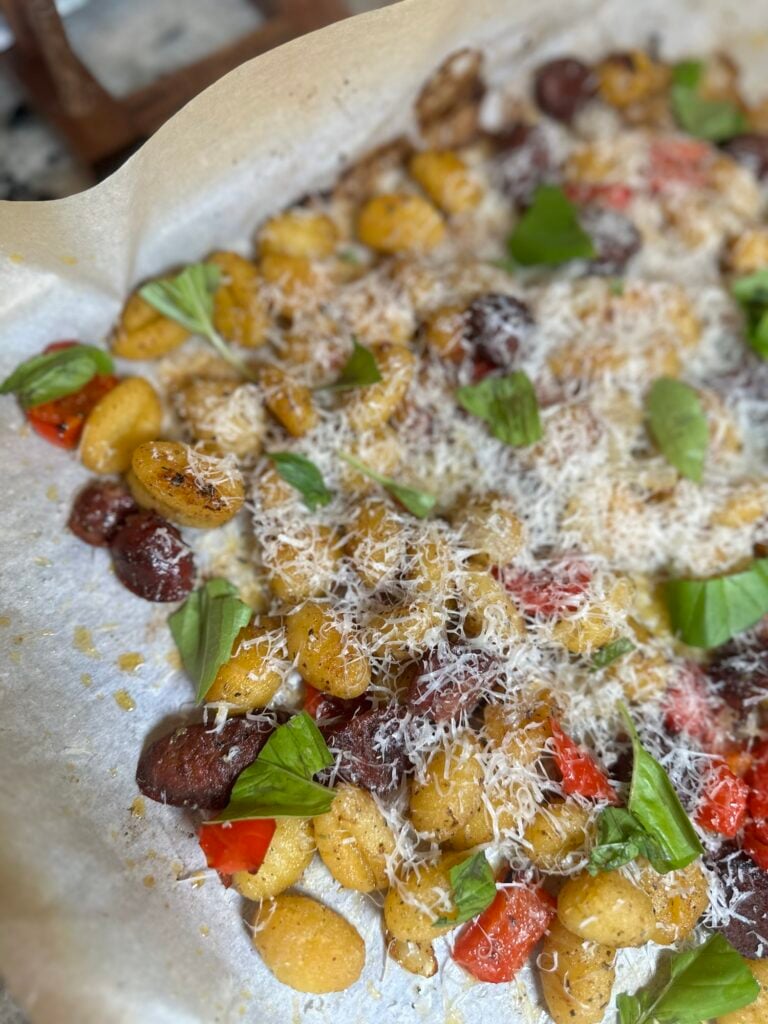 Sheet pan smoked Italian sausage with roasted peppers, onions and crispy potato gnocchi.