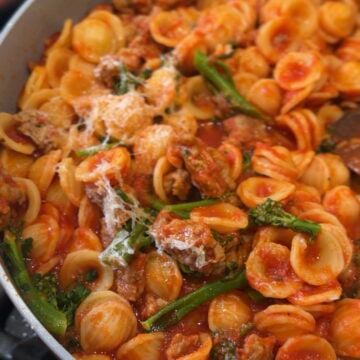 Orecchiette pasta with Italian sausage, broccoli rabe, tomato sauce and grated Parmesan inspired by Ina Garten’s recipe.
