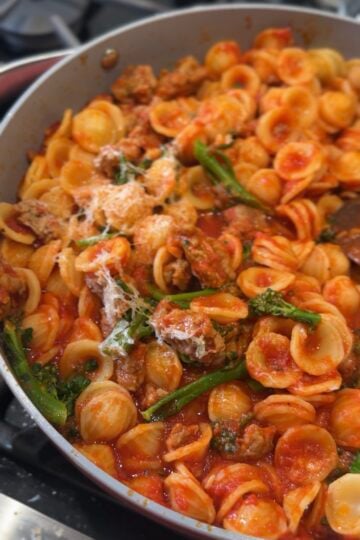Orecchiette pasta with Italian sausage, broccoli rabe, tomato sauce and grated Parmesan inspired by Ina Garten’s recipe.