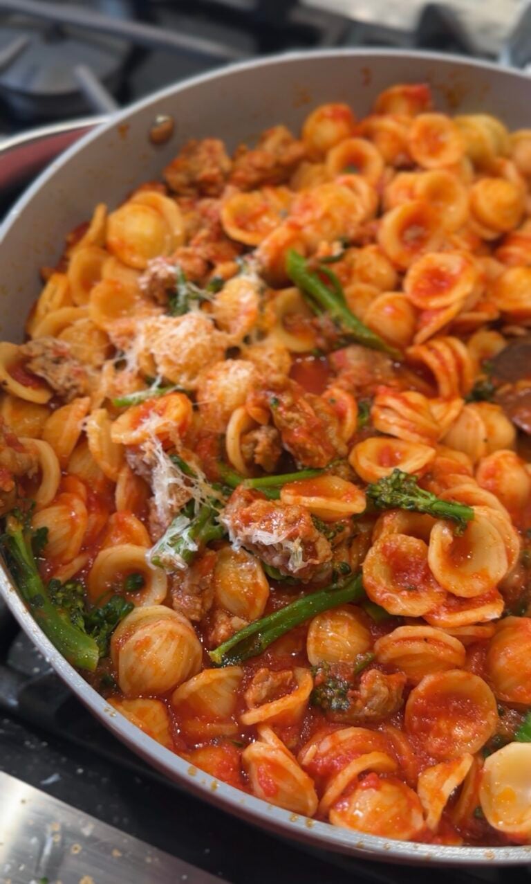 Orecchiette pasta with Italian sausage, broccoli rabe, tomato sauce and grated Parmesan inspired by Ina Garten’s recipe.