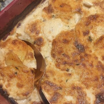 Tyler Florence’s potatoes au gratin with thinly sliced potatoes baked in cream and Parmesan cheese