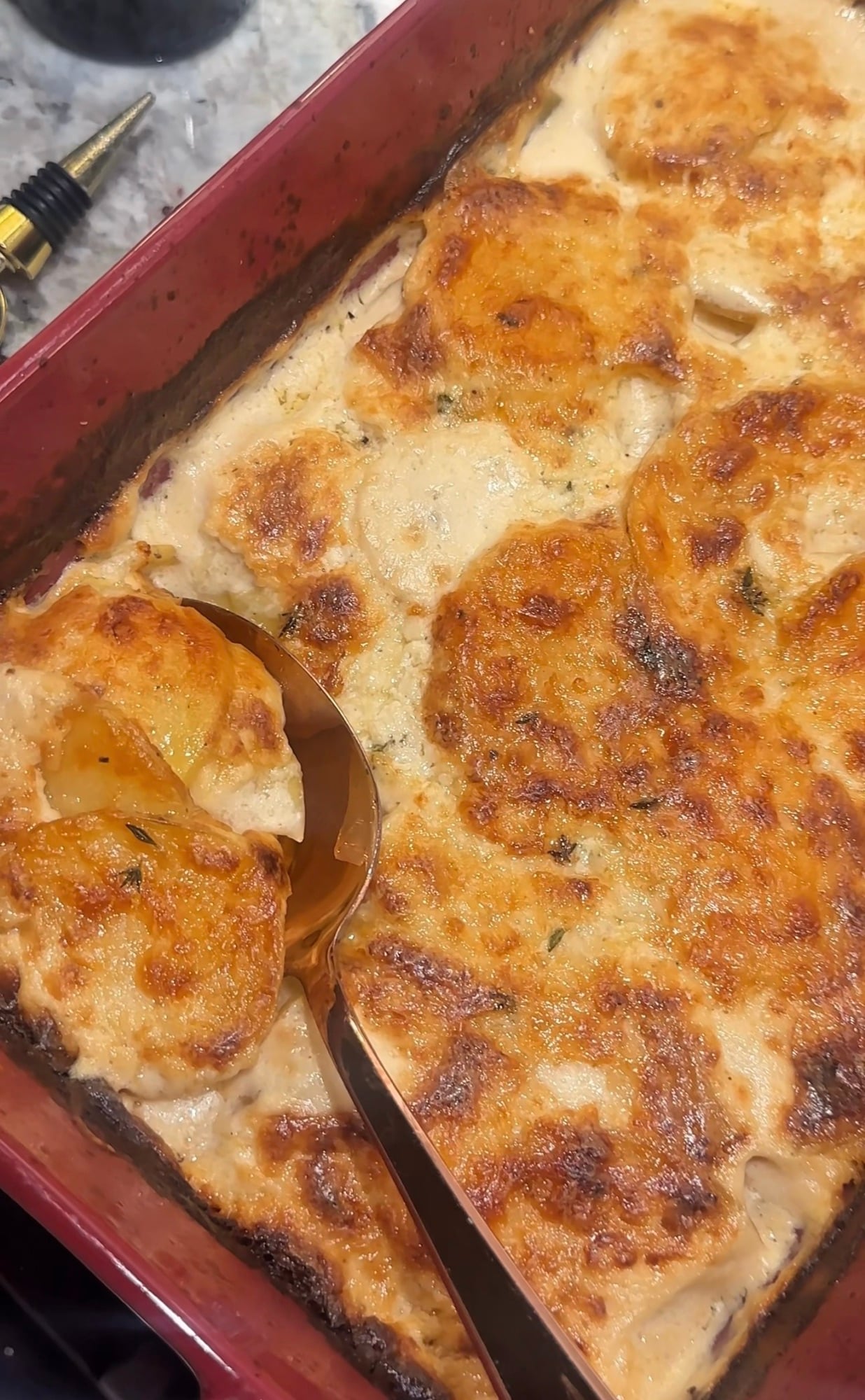 Tyler Florence’s potatoes au gratin with thinly sliced potatoes baked in cream and Parmesan cheese