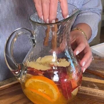 Fall Sauvignon Blanc infused with apple slices, orange slices, and cinnamon sticks.