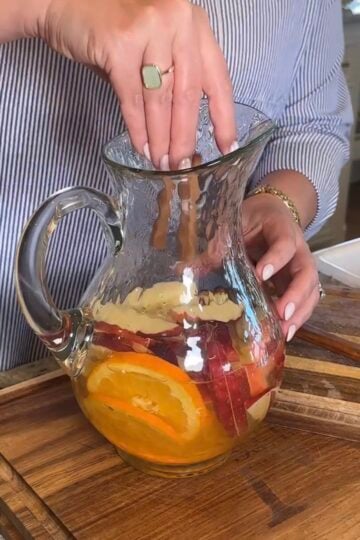 Fall Sauvignon Blanc infused with apple slices, orange slices, and cinnamon sticks.