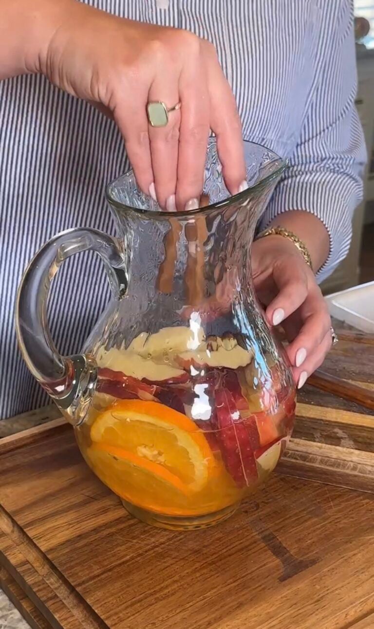 Fall Sauvignon Blanc infused with apple slices, orange slices, and cinnamon sticks.